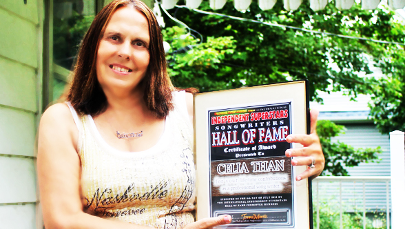 "Celia Than"  posing with the award received in the post from Keith Bradford