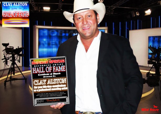 Clay Alston holds the award received from the IDSS Hall Of Fame